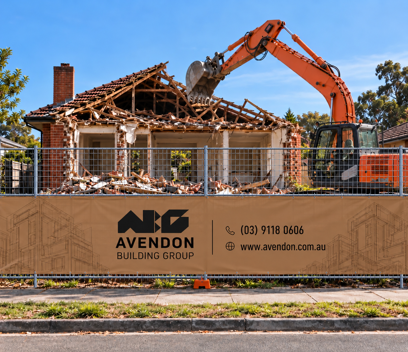 House demolition behind a full-height temporary fence with an Avendon Building Group banner